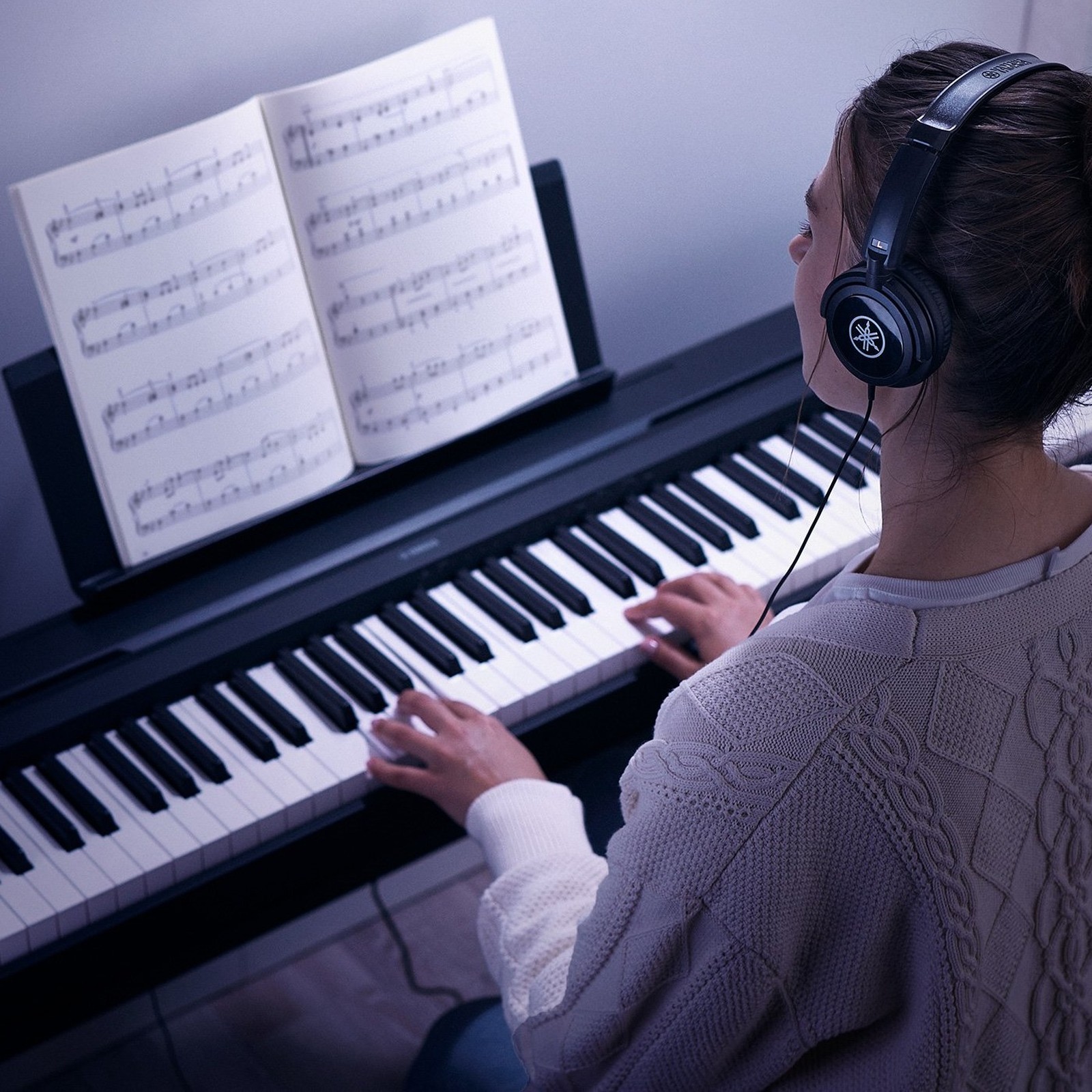 Pianist playing with headphones on the Yamaha P-45B