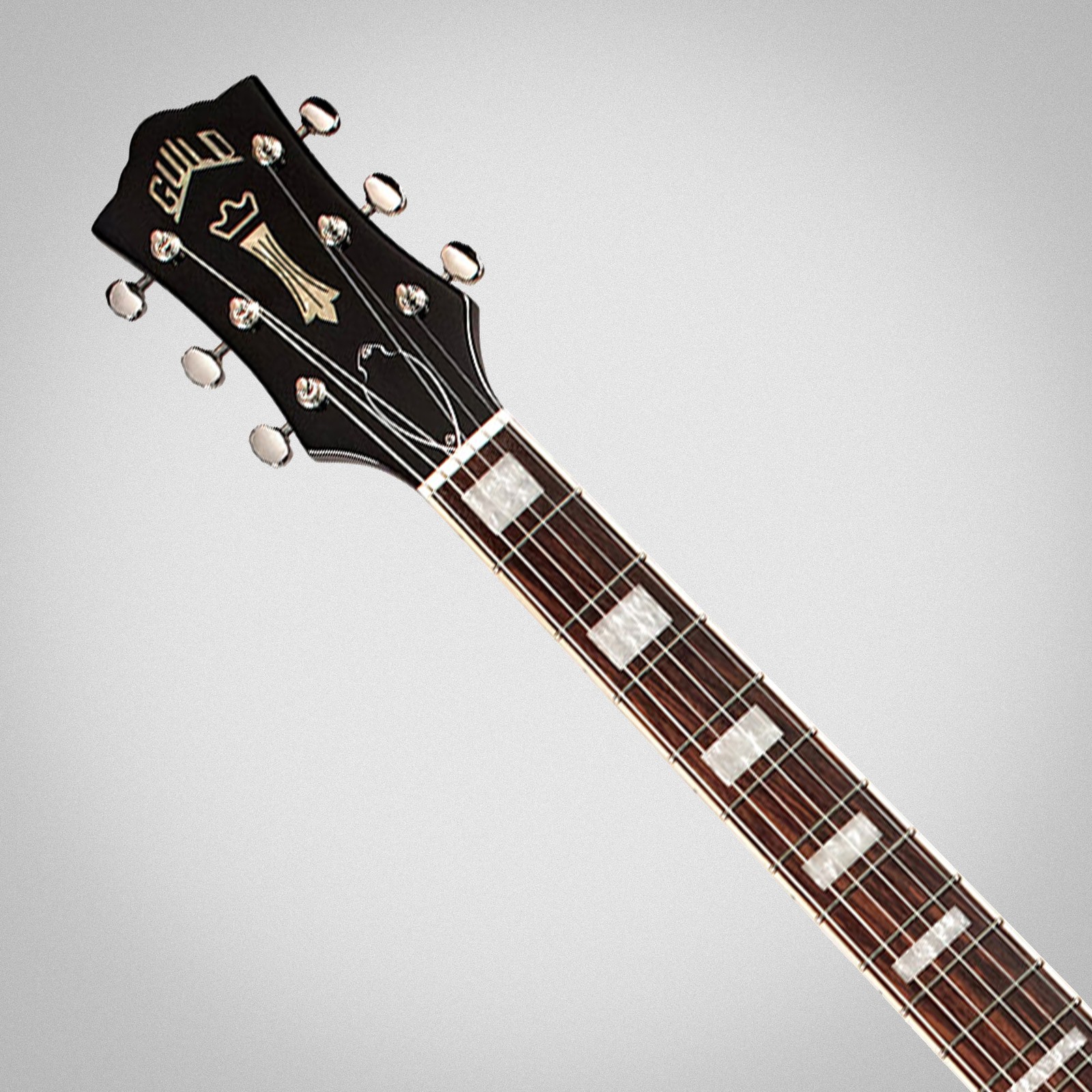 Guild Polara Deluxe Canyon Dusk, Logo auf Kopfplatte