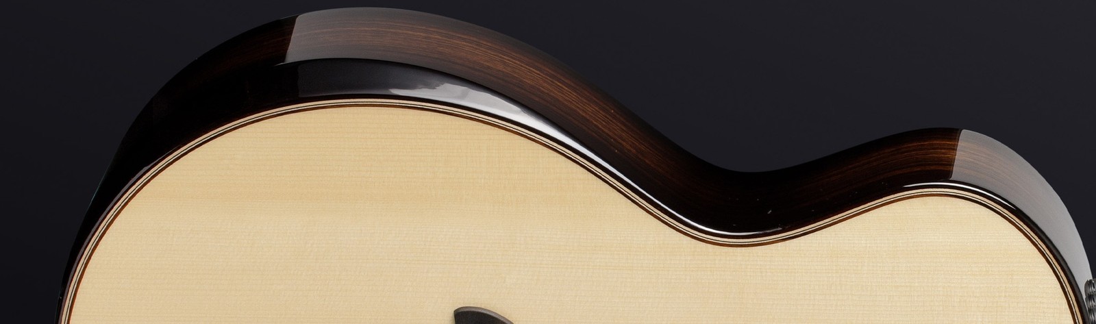 Taylor Builder’s Edition 814ce's soundboard, with a curved arm rest