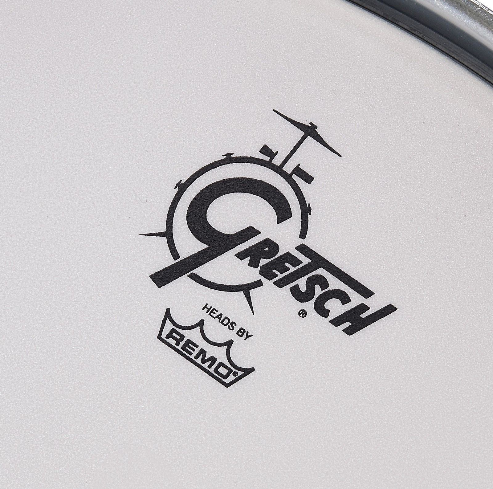 White bass drum resonant head with Gretsch logo