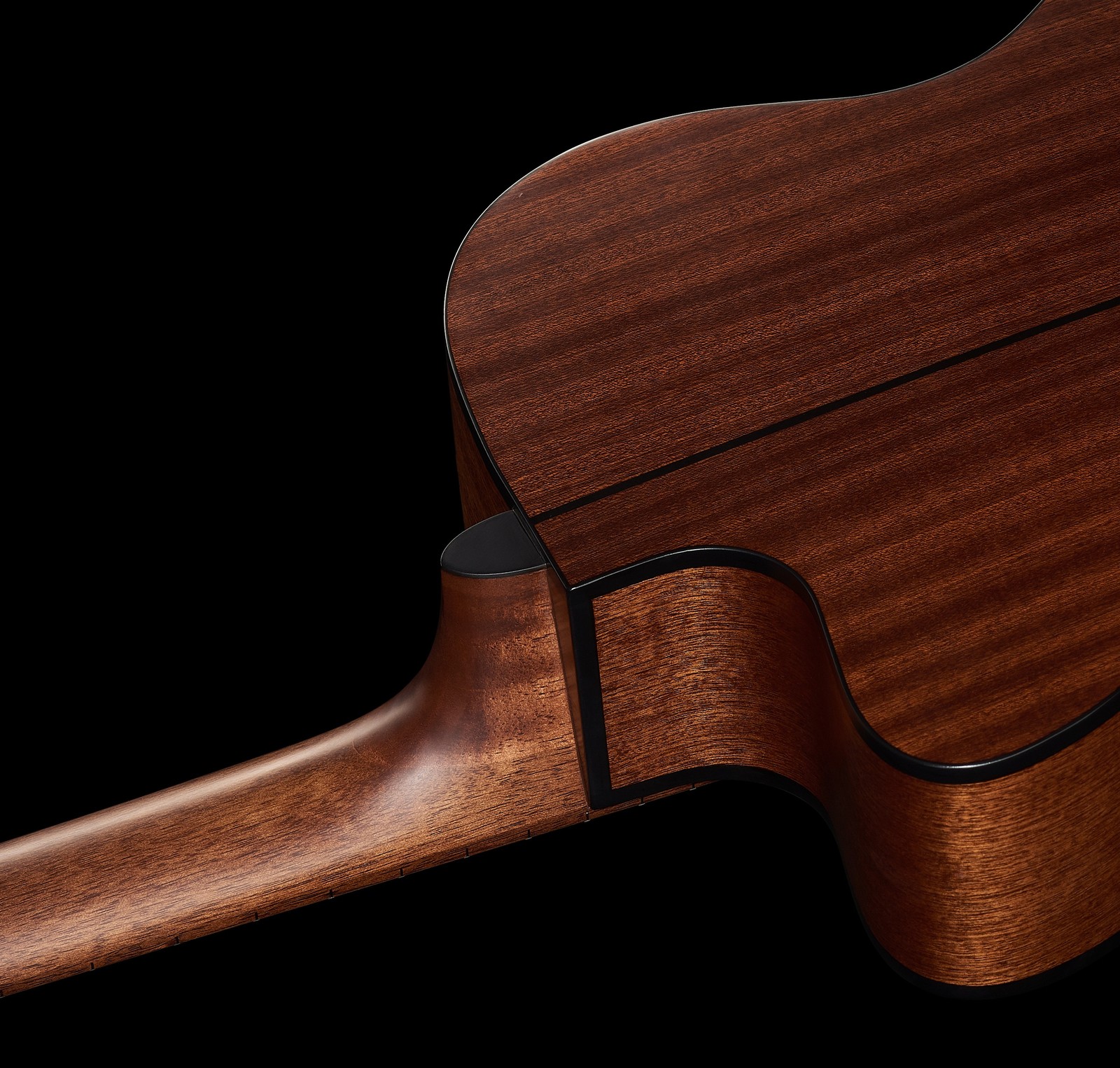 sapele mahogany back of an acoustic guitar with a cutaway