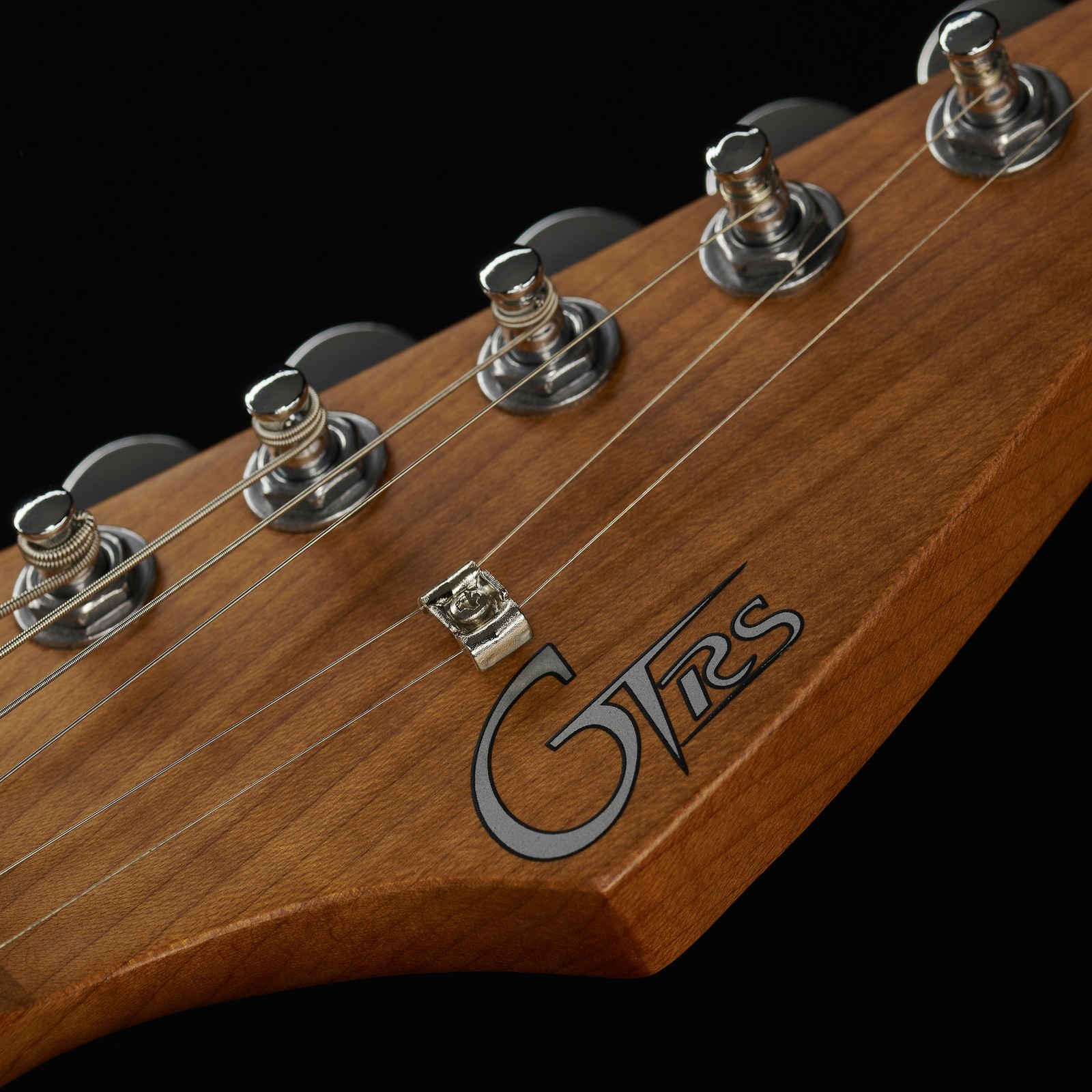 Mooer electric guitar headstock made from roasted maple