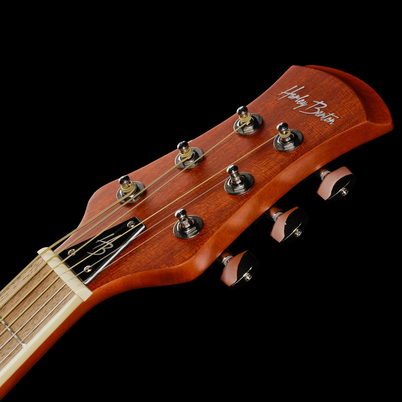 chrome tuners on a Harley Benton headstock