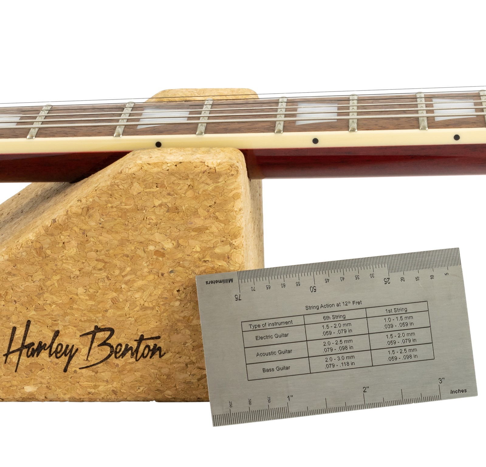 Harley Benton Parts String Action Gauge leaning against a Harley Benton Guitartech Neck Rest with a guitar neck