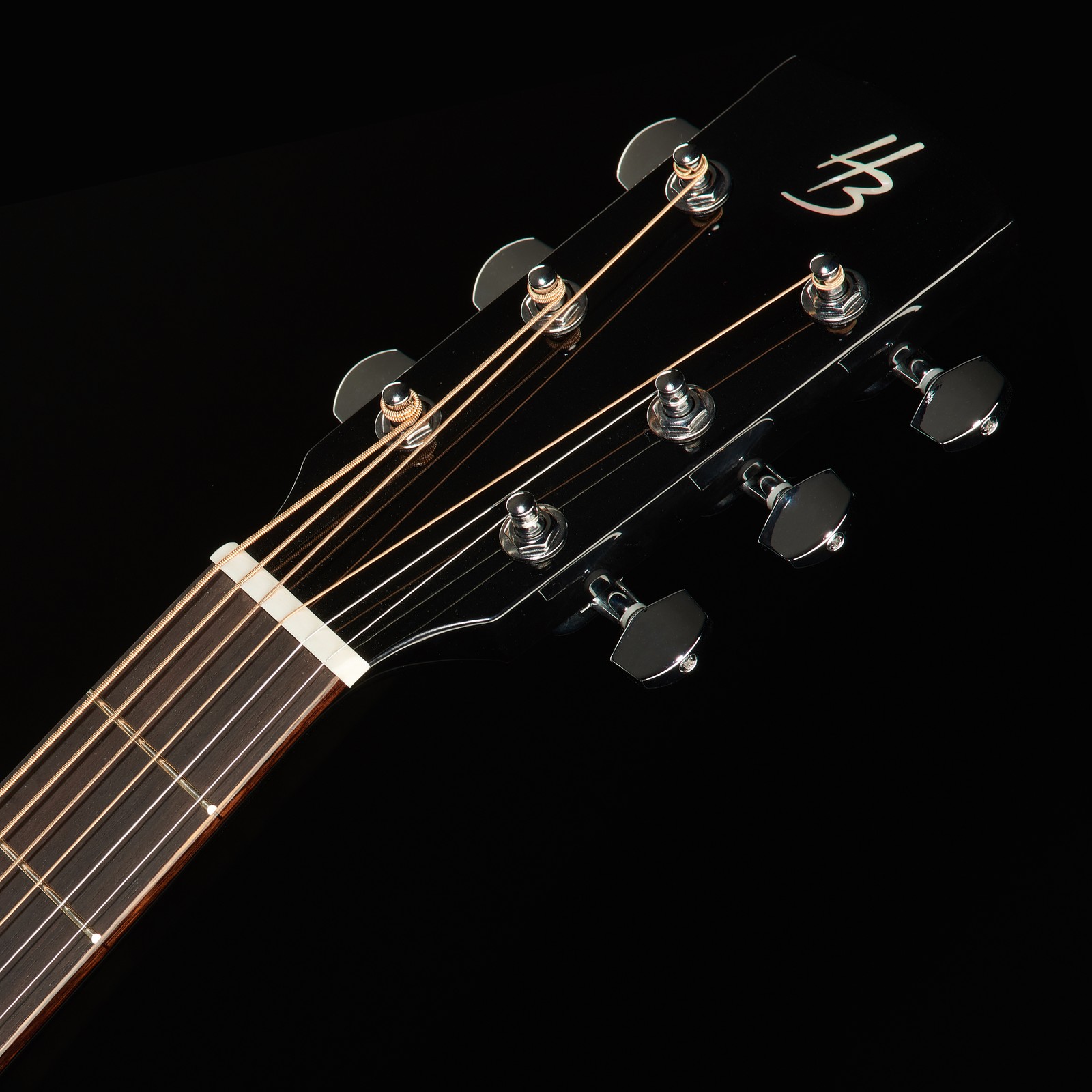 DLX diecast chrome machine heads on the headstock with HB logo