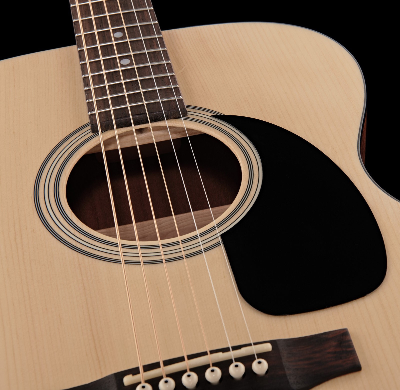 sound hole and pickguard on the solid spruce top of the Harley Benton Custom Line CLA-16S