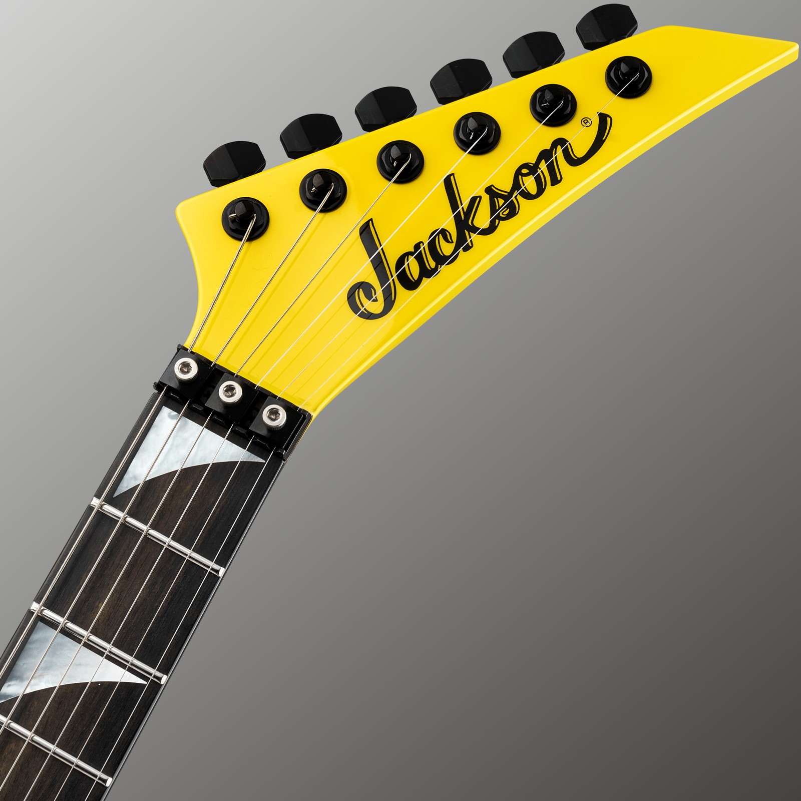 Gelbe Kopfplatte der Jackson American SRS Soloist SL2 FR LI mit Floyd Rose Klemmsattel