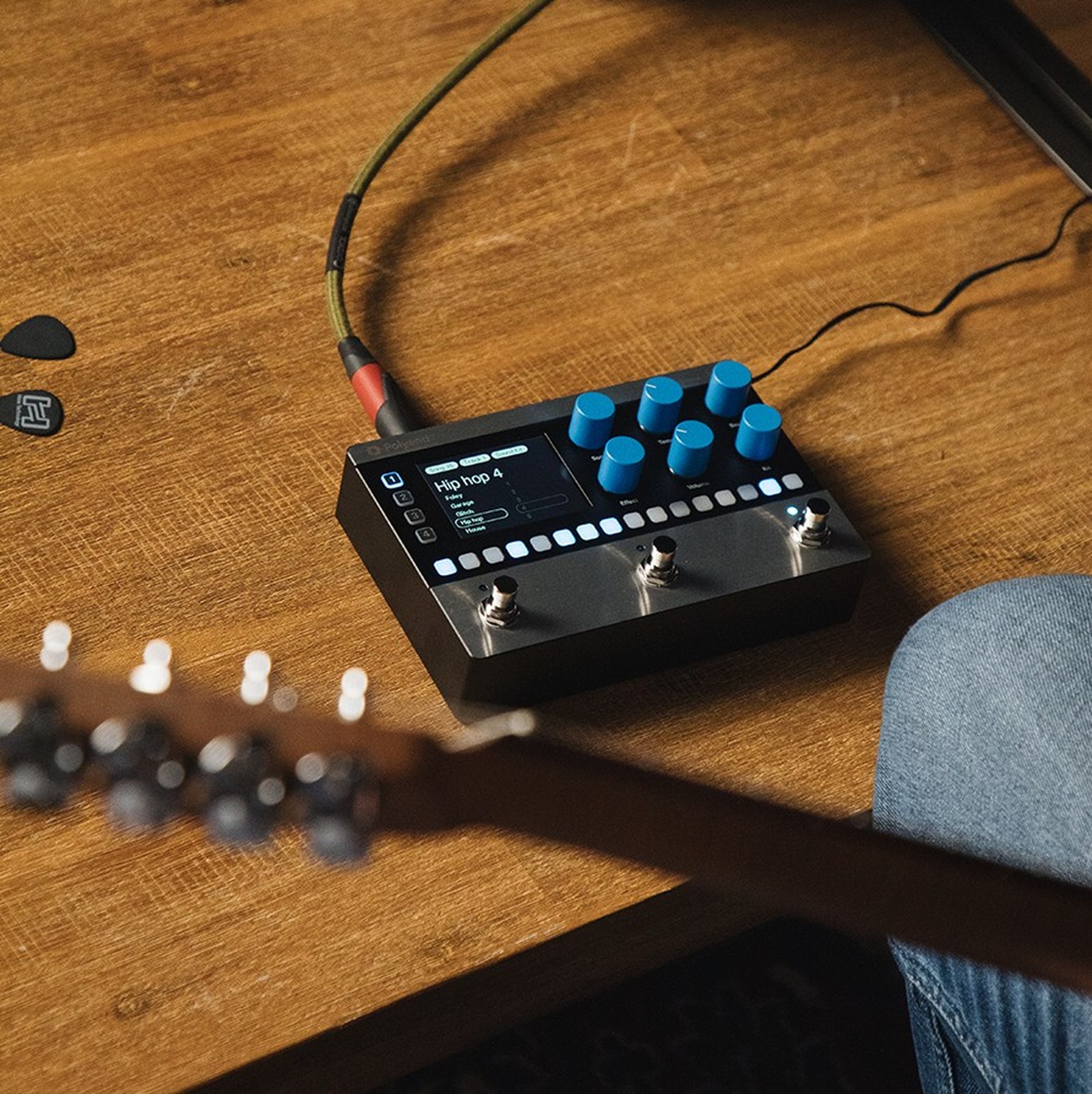 Guitarist using the Polyend Step, pedalboard drum machine