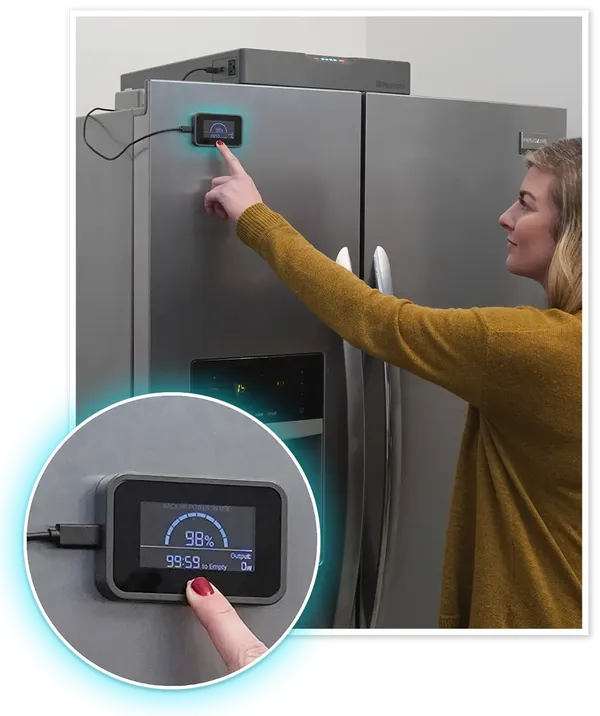 Woman using the magnetic remote display screen for Blackout Buddy