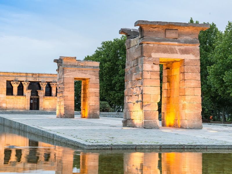 Large outdoor displays of ancient ruins surrounded by water