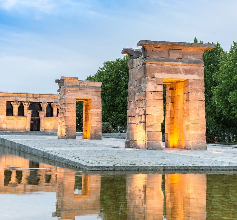 Large outdoor displays of ancient ruins surrounded by water