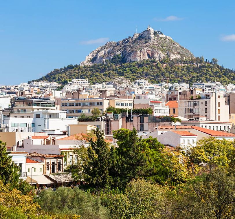 Aerial view of a city with a mountain in the distance