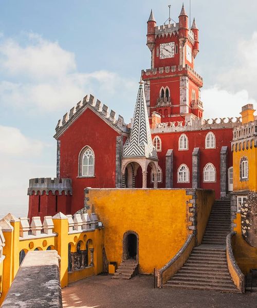 A bright red and yellow building resembling a castle