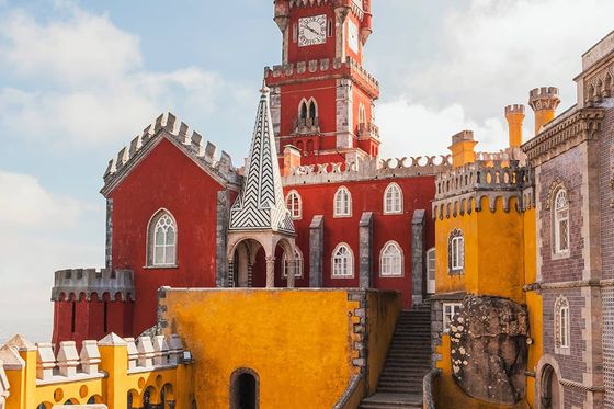 A bright red and yellow building resembling a castle