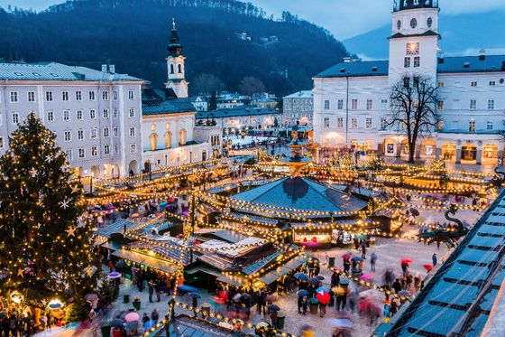 Aerial view of a Christmas market in a city square at night