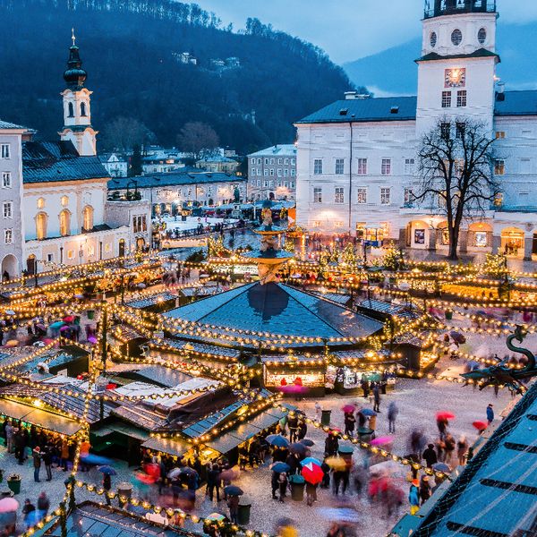 Aerial view of a Christmas market in a city square at night