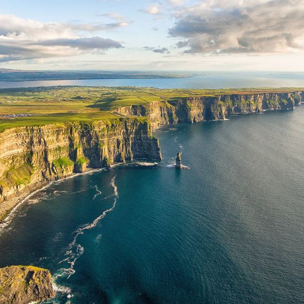 A view of the Cliffs of Moher in Ireland next to the ocean