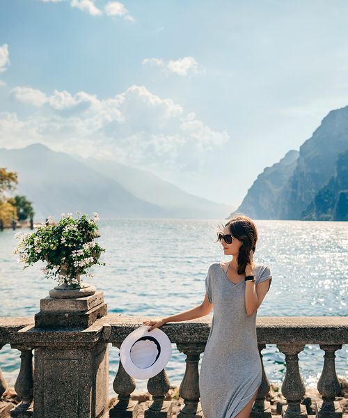 woman standing in front of lake como 
