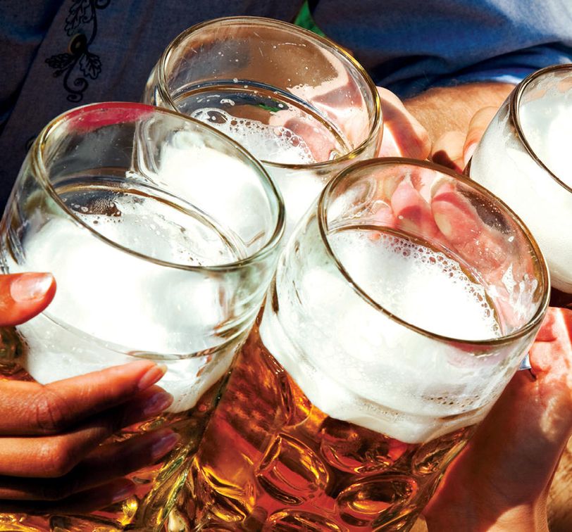 four steins of beer cheering