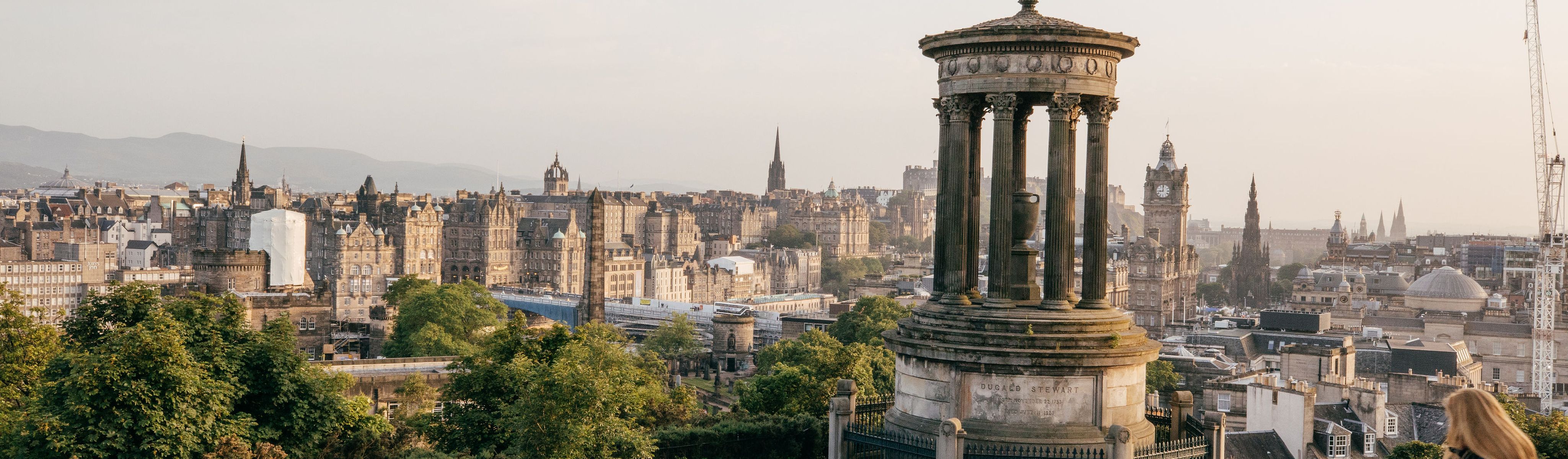 people walking around Calton Hill in Edinburgh Scotland