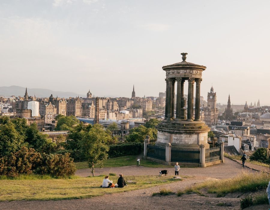 people walking around Calton Hill in Edinburgh Scotland