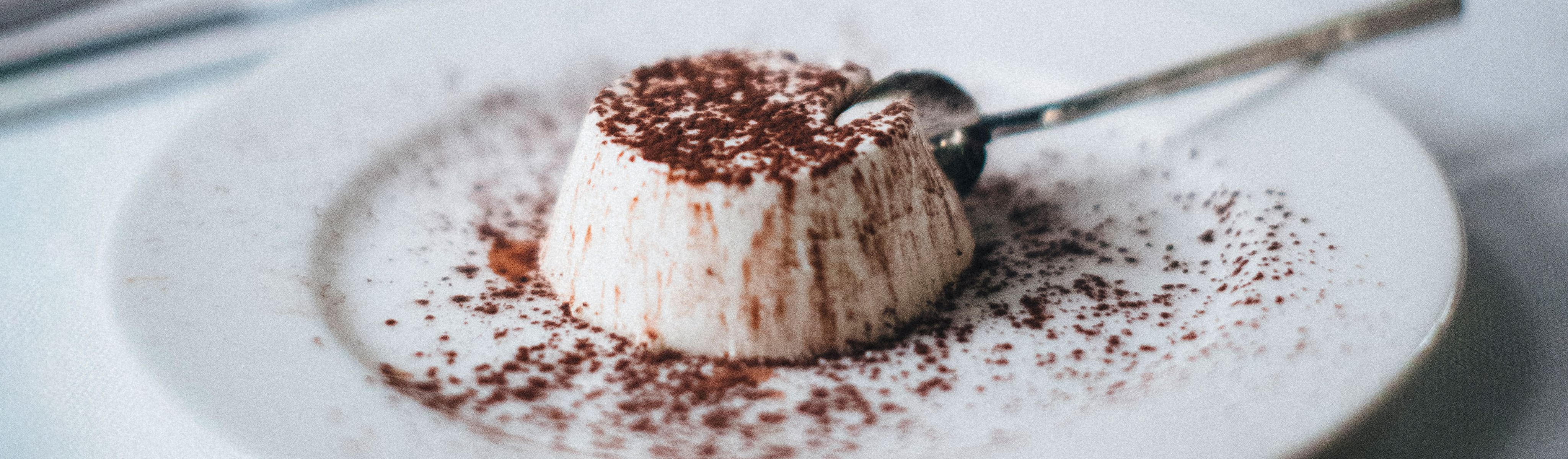 panna cotta sprinkled with cocoa powder