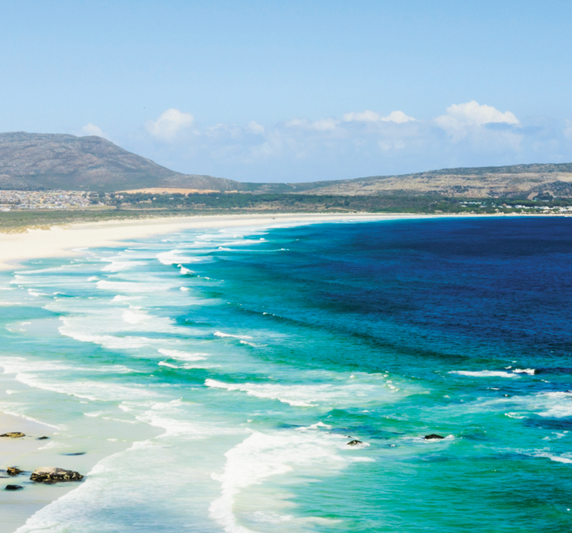 blue ocean waves crashing on the sand along the coast of south africa