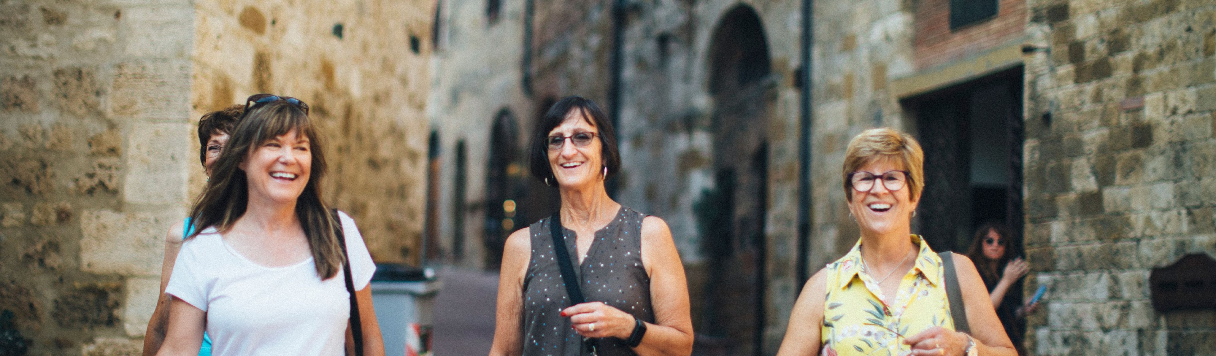 group of women walking in europe smiling