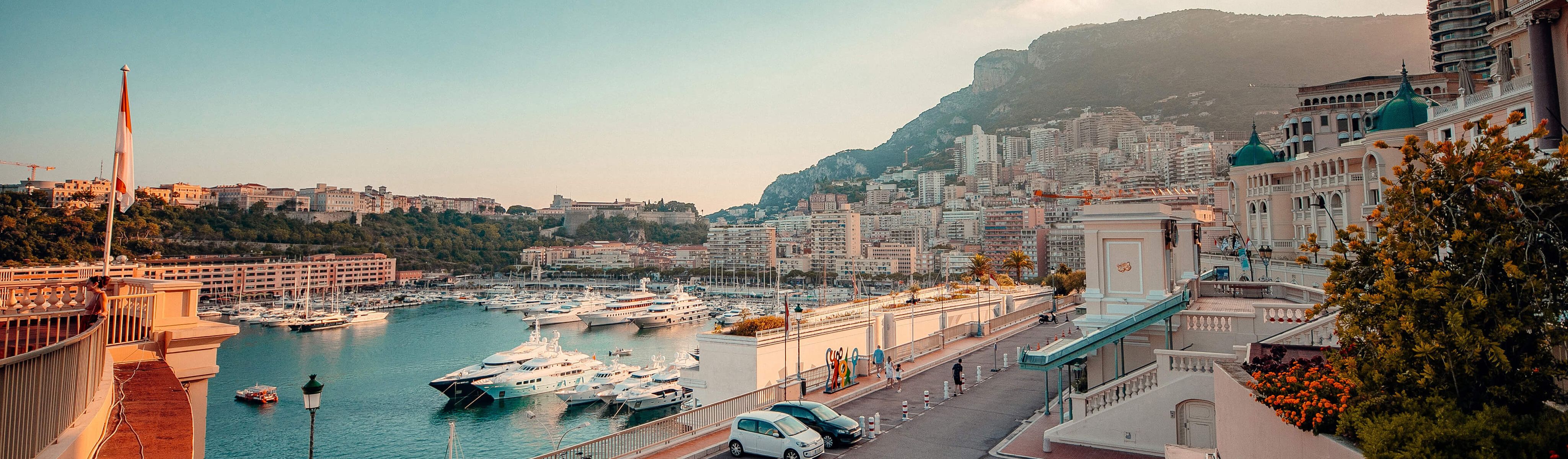 boats docked in a marina along the coast in Monaco