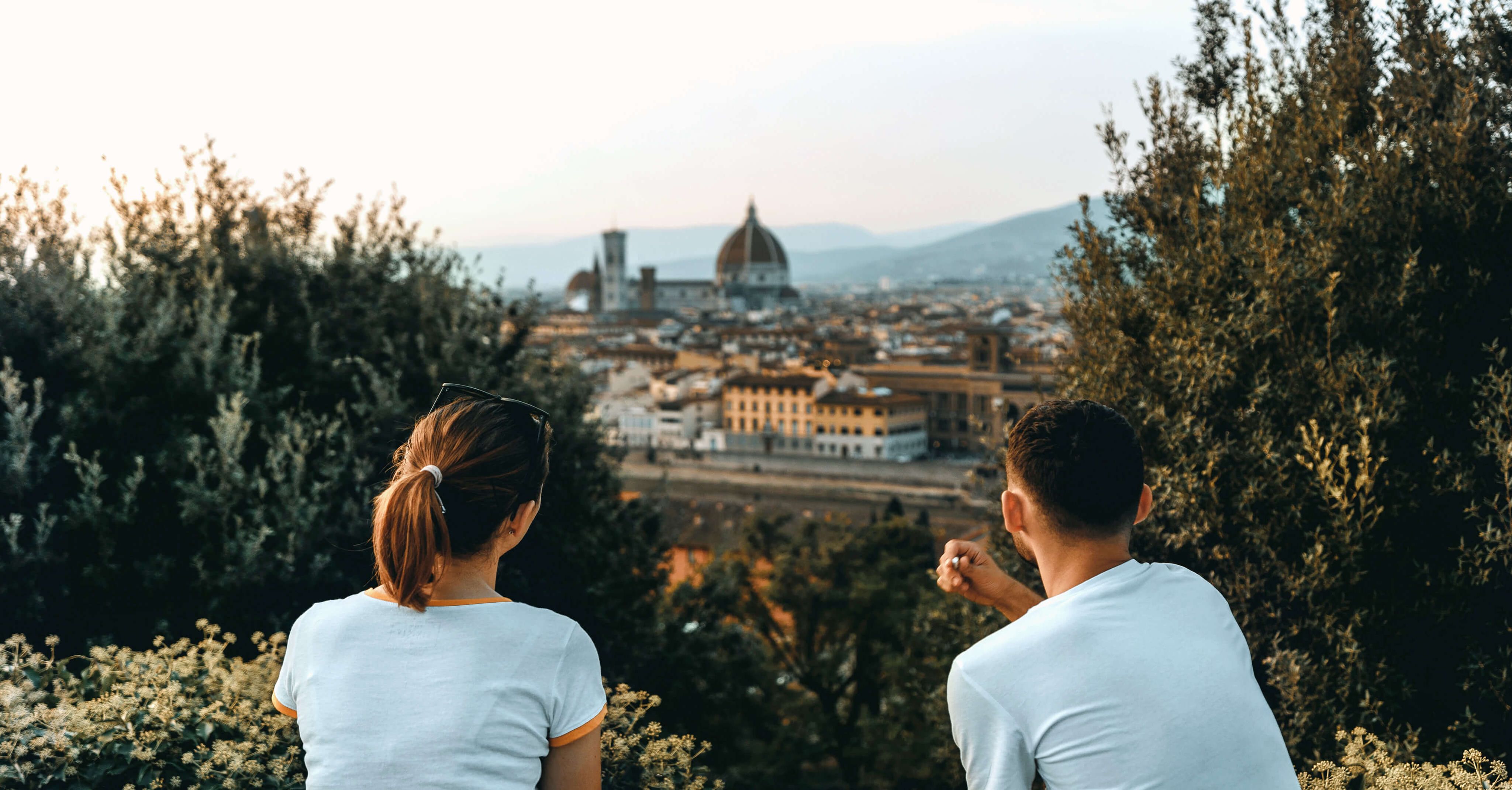 two people looking at view of the duomo in florence italy