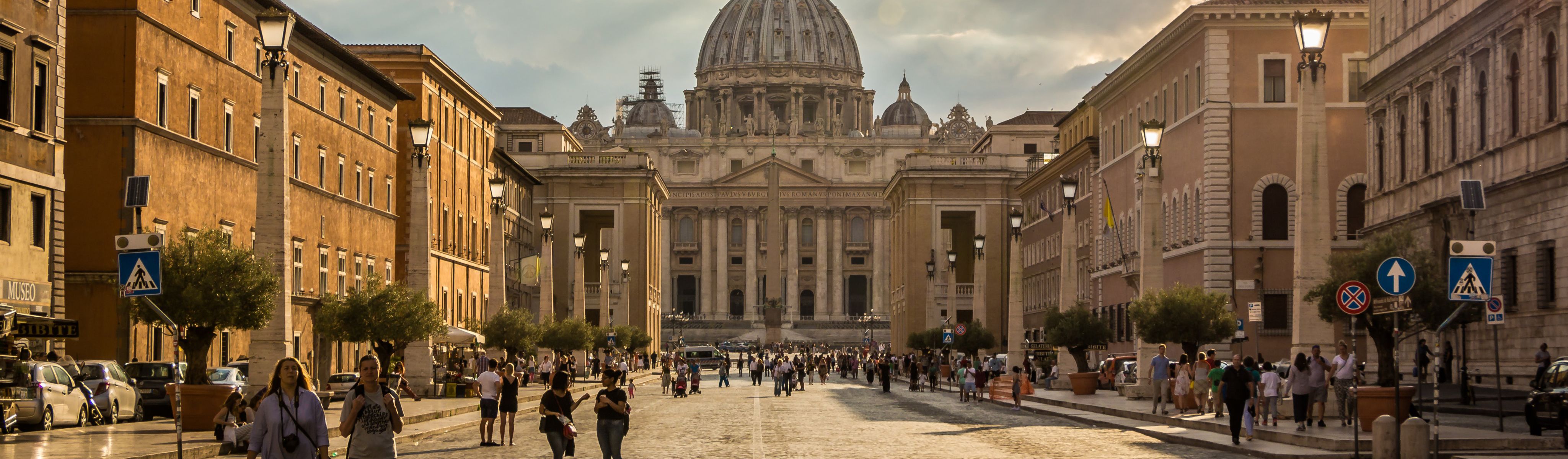 people walking in front of the vatican in rome italy