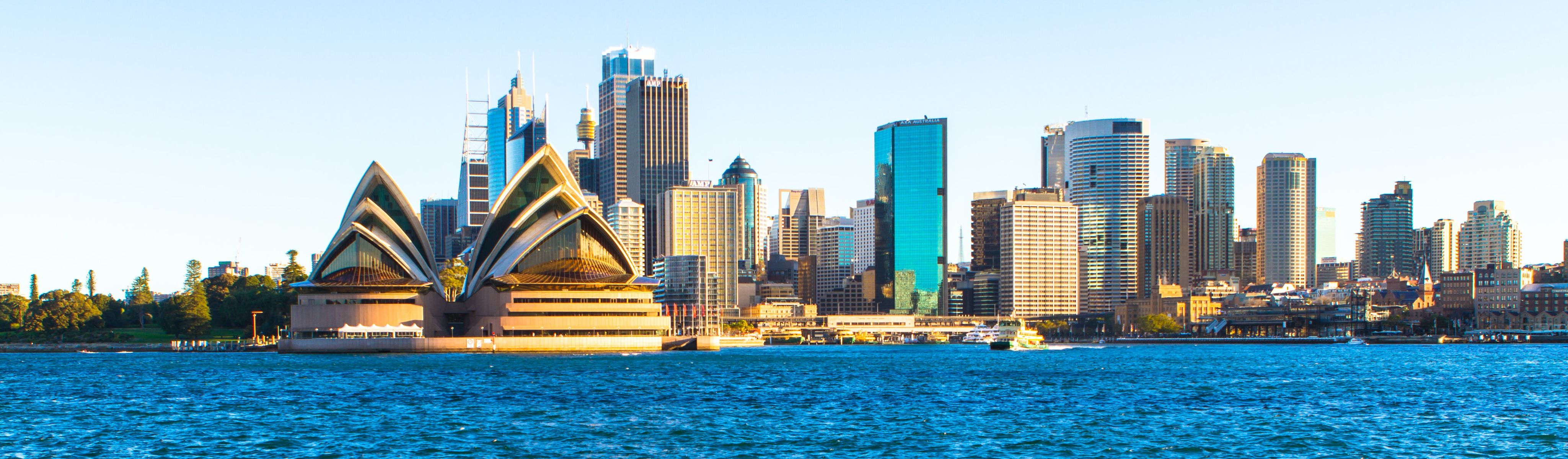 sydney opera house along the ocean and skyline in sydney australia