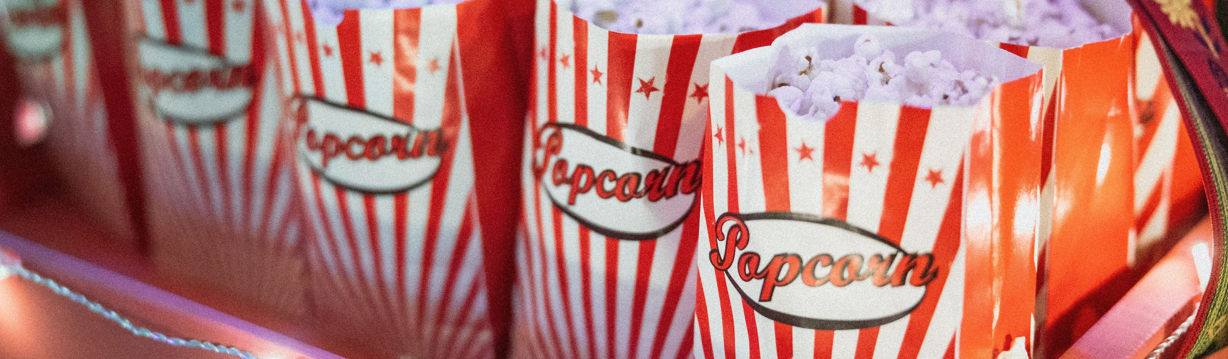 red and white stripped bags filled with popcorn