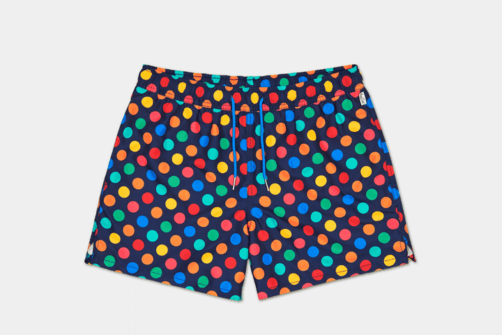 A Swim short with dotted pattern on a grey backgroun