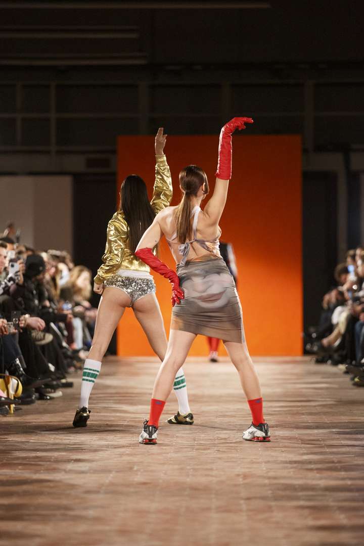 two people dancing on the runway