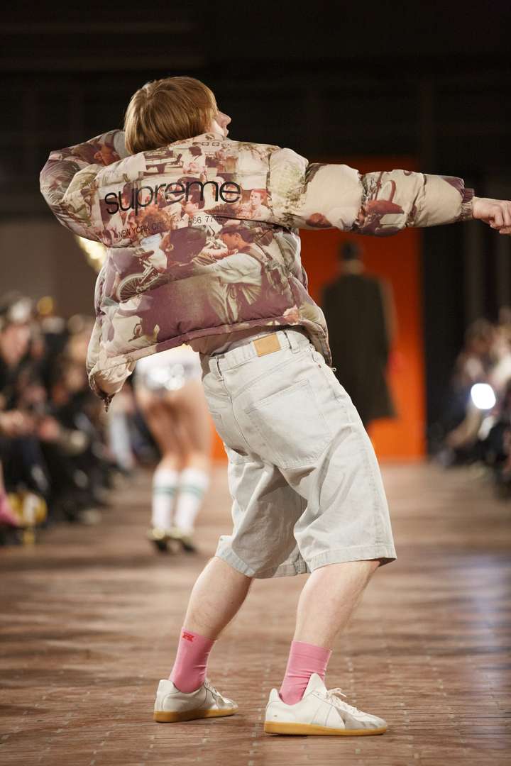 a person dancing on the runway wearing pink happy socks