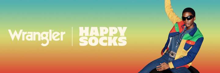 A rectangle with a gradient background, going from red near the bottom, through yellow, to azure at the top. On the right-hand side is a person wearing a colorful Wrangler x Happy Socks Denim Jacket. Overlaid on the left is a white text reading, "Wrangler" and "Happy Socks".