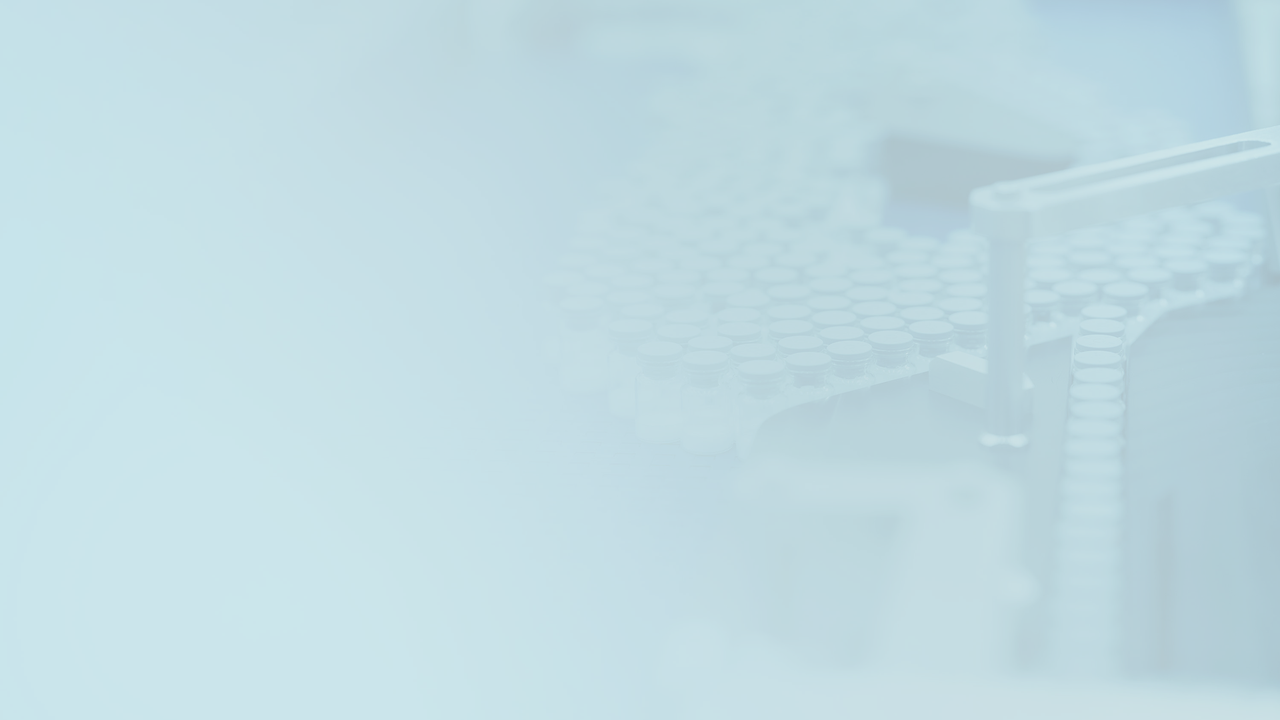 Blurred image of an Octapharma production line, with numerous vials. 