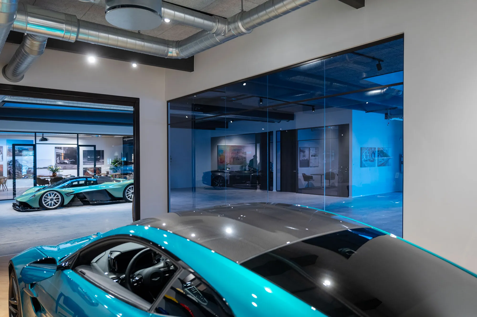 Bespoke, coloured glazed partitions for a premium automotive showroom