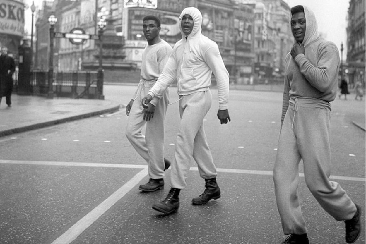 Muhammed Ali wearing a white hoodie in London