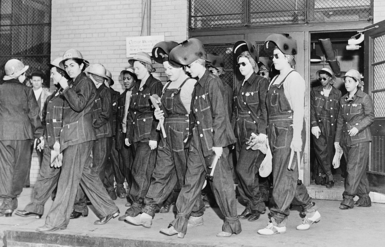 Black & white picture of welders in raw denim clothing