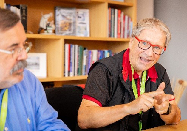 v.Prof. OA Dr. Dr. Angelo Troedhan, discussing about combining piezo and rotary drives.