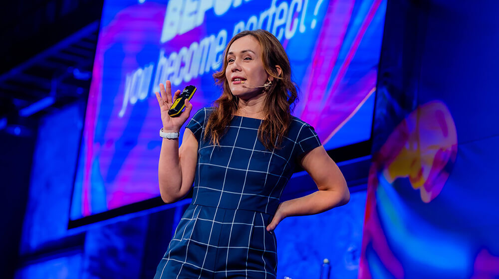 Kristina speaking on the Mindvalley stage