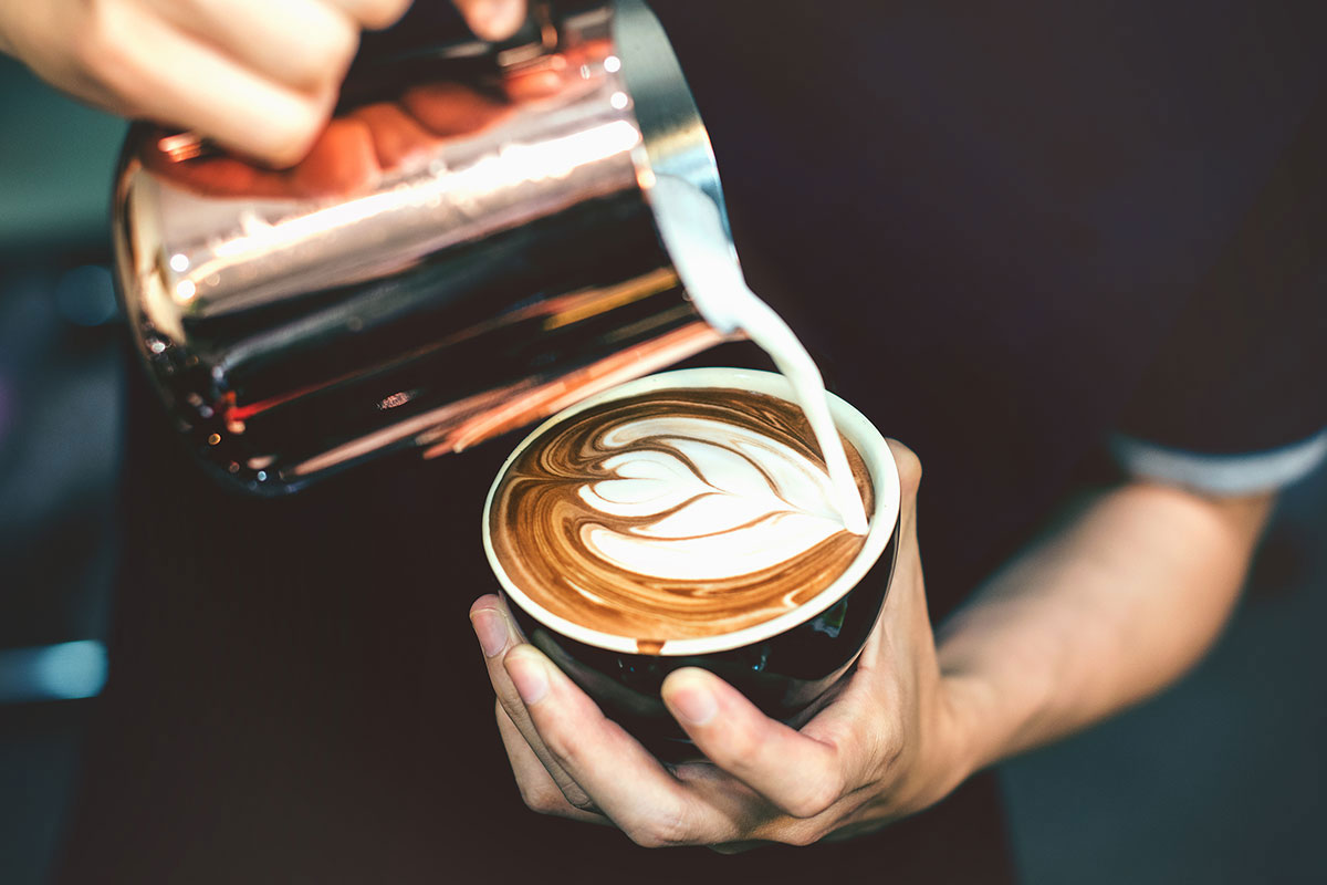 Barista pouring coffee