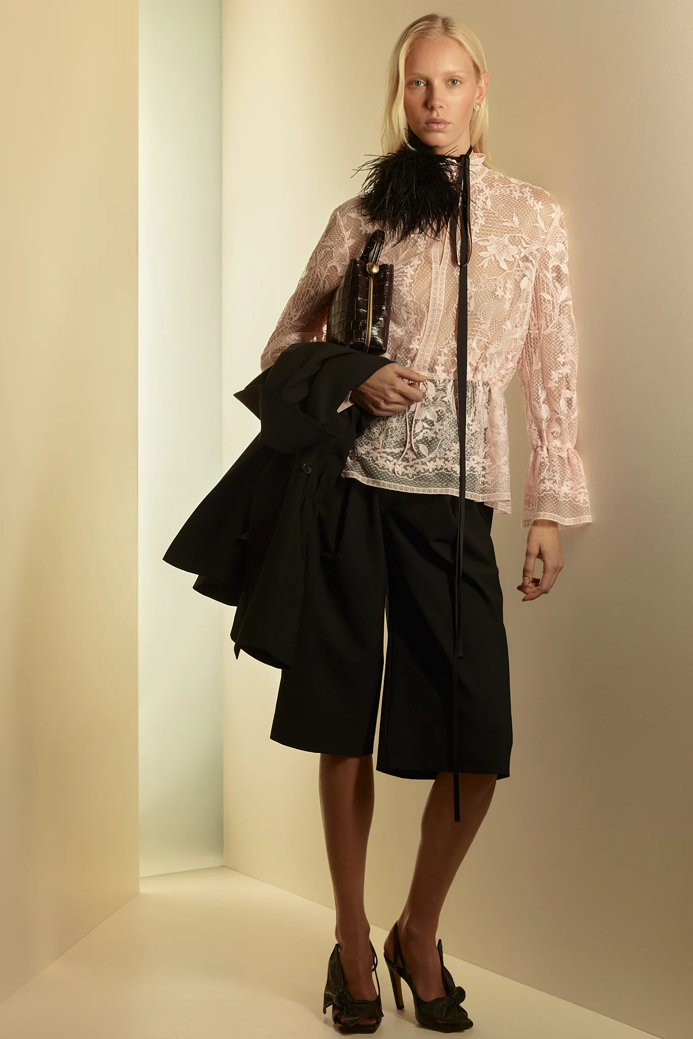 Romantic and delicately made, the Lace Blouse in a barely there angel pink is a study in feminine detail. A loose, hip-length silhouette features silk-covered button fastening, fine silk cord at the waist and cuff and a lace border at the front, neck, hem and sleeve, layered over a silk crepe de chine slip.