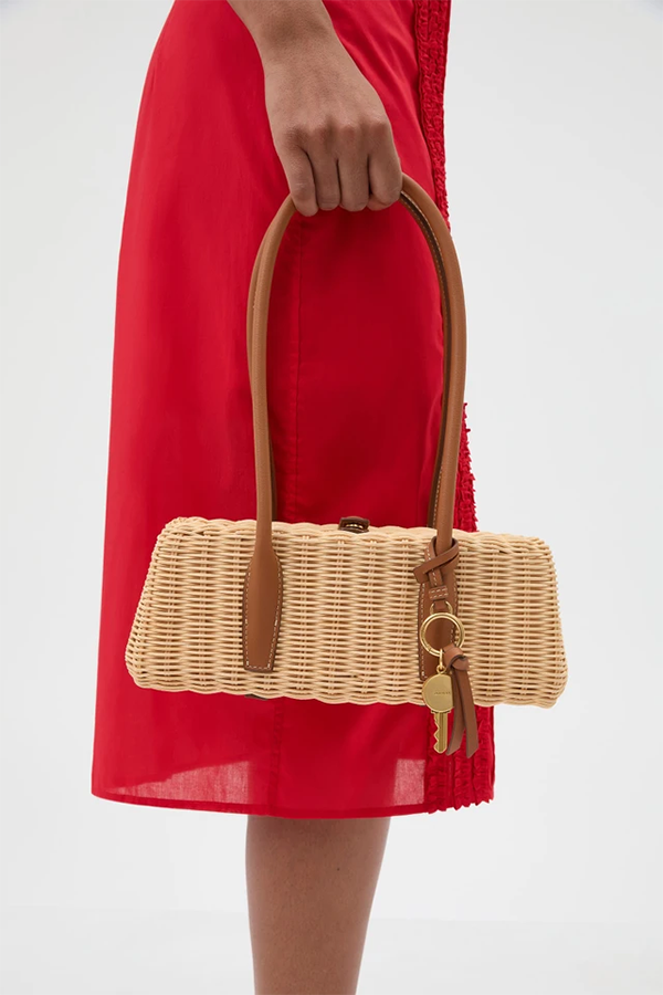 The Louisa Wicker Bag is crafted from woven natural fibres with smooth leather accents for a refined, artisanal finish. Featuring a snap stud closure, cotton-lined interior with zip pocket, and structured top handle, it offers lightweight elegance for occasion and everyday wear.