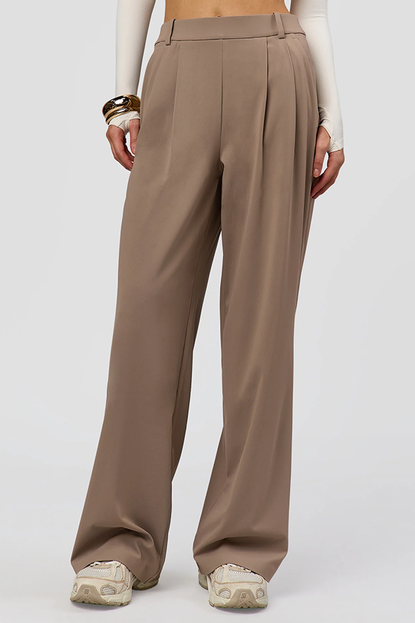 Introducing the Taupe Ash StretchShift Wide Leg Pant: an elevated functional style that redefines your all day active wardrobe. These pants are designed for life outside of the gym, becoming your go-to essential.