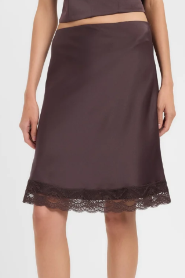 Delicate and quietly considered, the Palermo Lace Midi Skirt is crafted in our Palermo fabrication with a fluid A-line silhouette that falls to a midi length, finished at the hem with a scalloped lace trim for a subtly feminine touch. The clean, minimal waistband and smooth fabrication keep the overall look refined and unfussy, letting the lace detail do the talking.