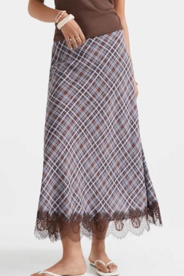 The lace trim midi skirt adds a feminine finish with its brown lace hem and flattering shape. Designed with a fitted silhouette, this piece brings texture and detail to your everyday wardrobe.