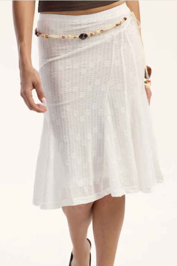 The Rusty Roma lace midi skirt sits low on the hip and sweeps out to a full flared hem. Textured lace fabric with a woven floral pattern throughout keeps it lightweight and easy to wear from the beach to wherever the day goes.